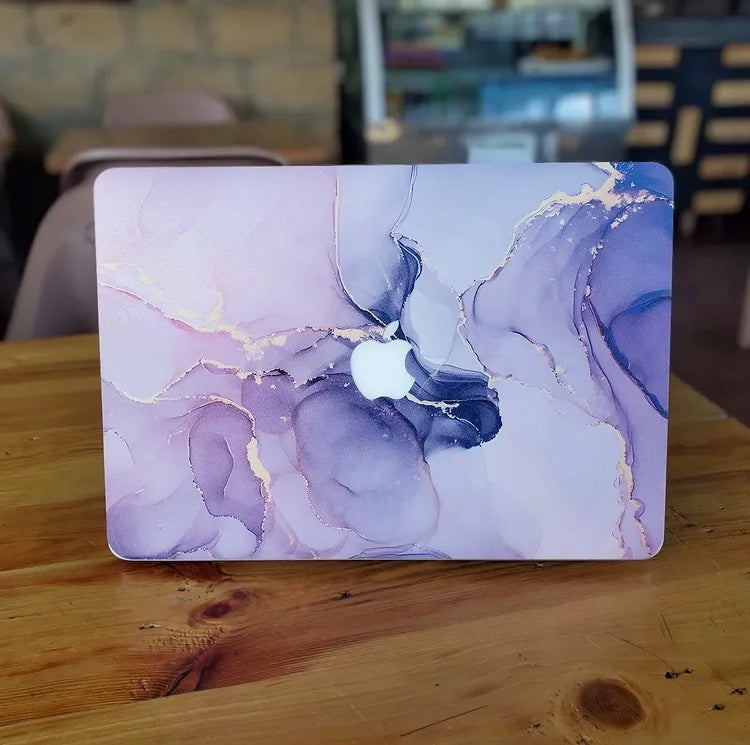 MacBook laptop skin by Tella Skins — real product photo