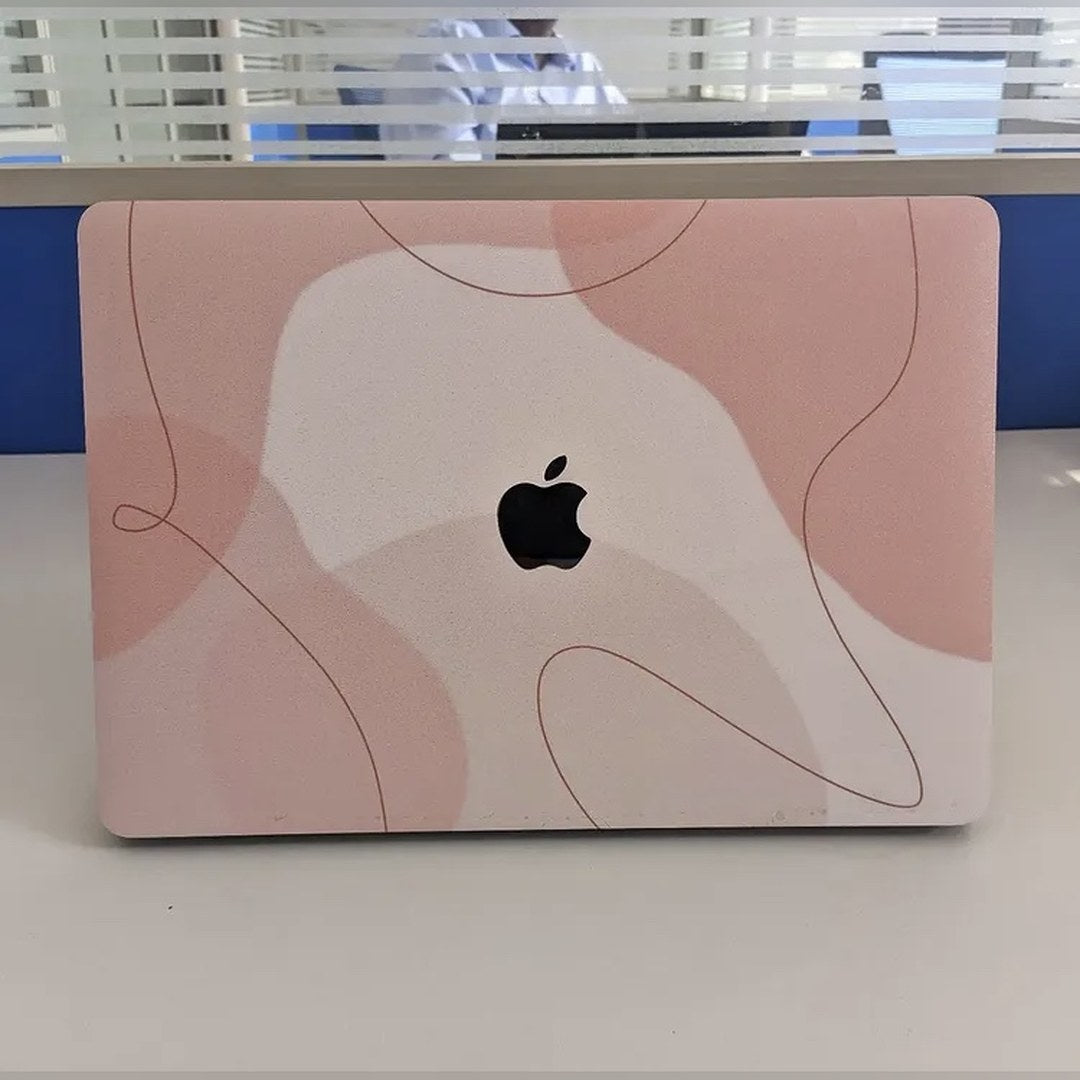 Blush Contour laptop skin on a MacBook lid