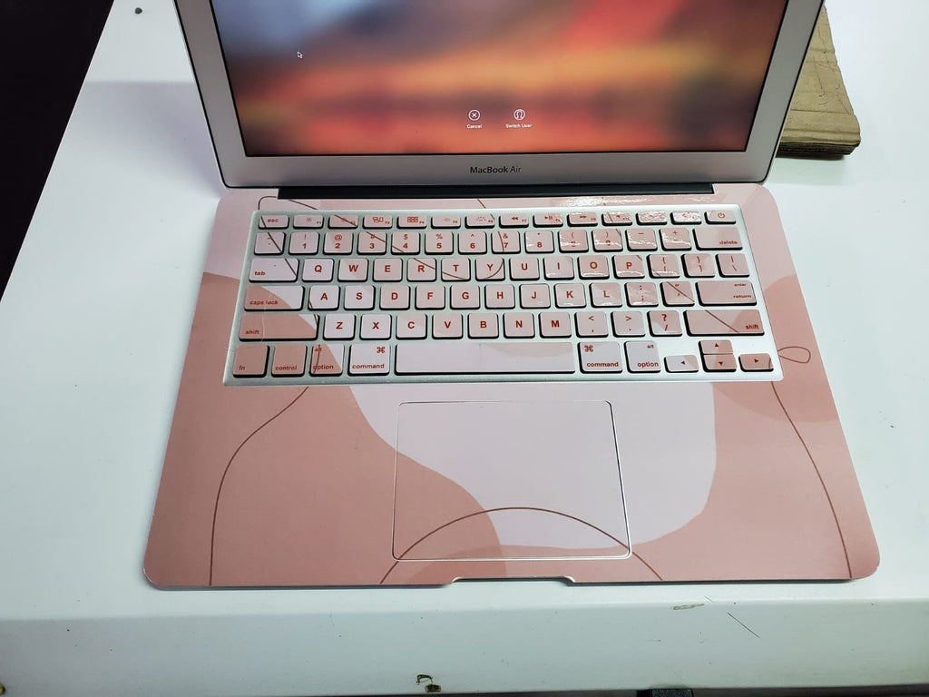 Blush Contour laptop skin on a MacBook keyboard