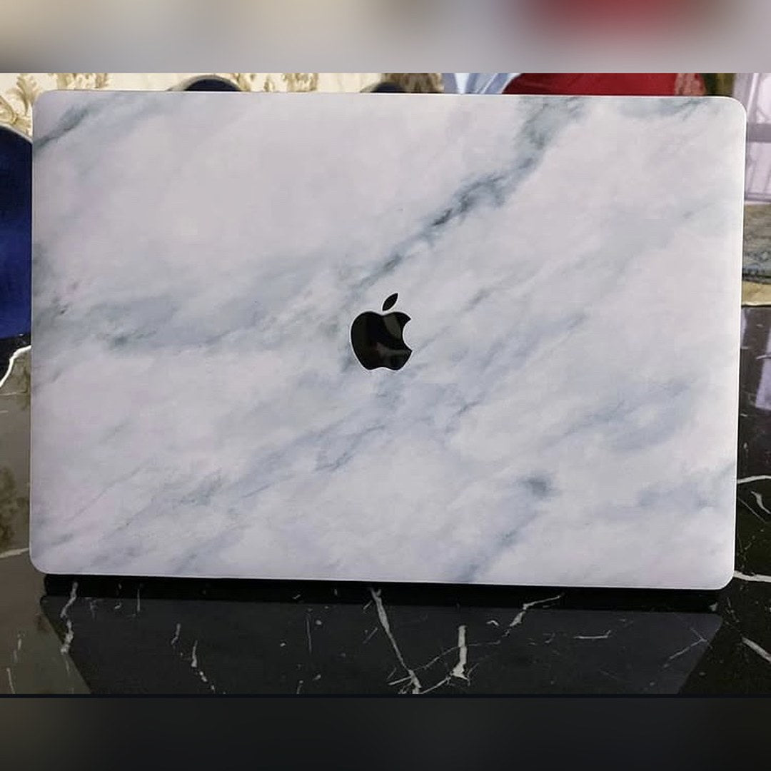 Carrara Grey laptop skin on a MacBook lid
