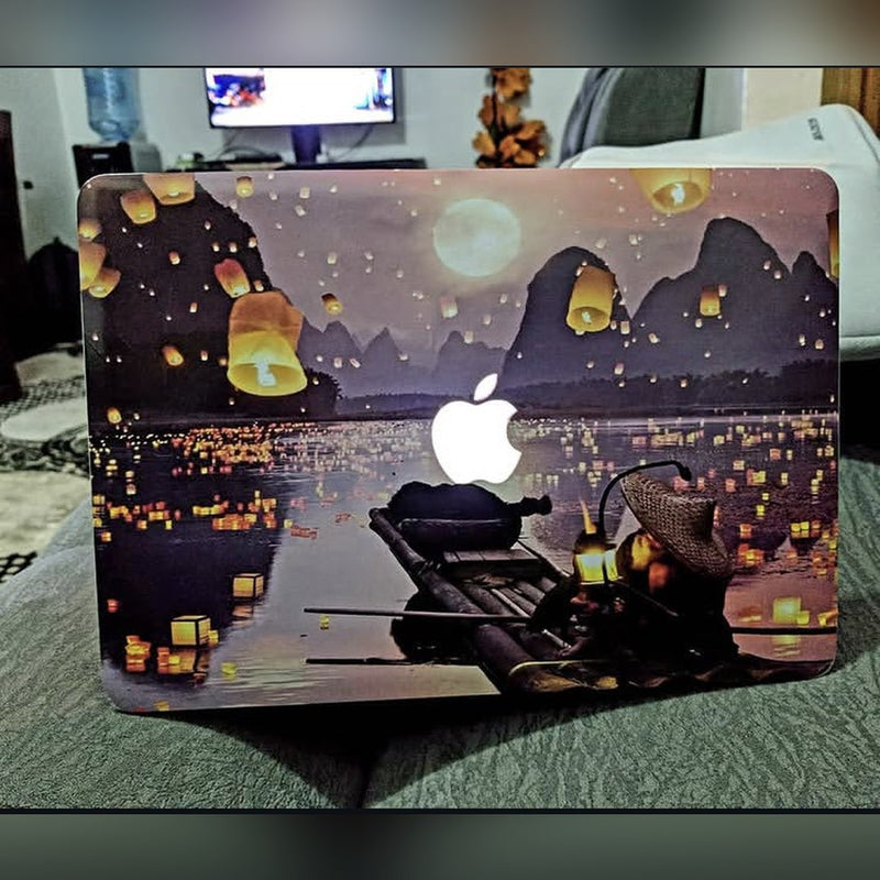 Floating Lanterns laptop skin on a MacBook lid