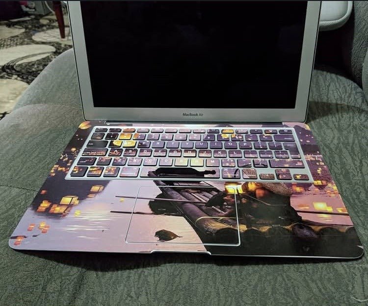 Floating Lanterns laptop skin on a MacBook keyboard