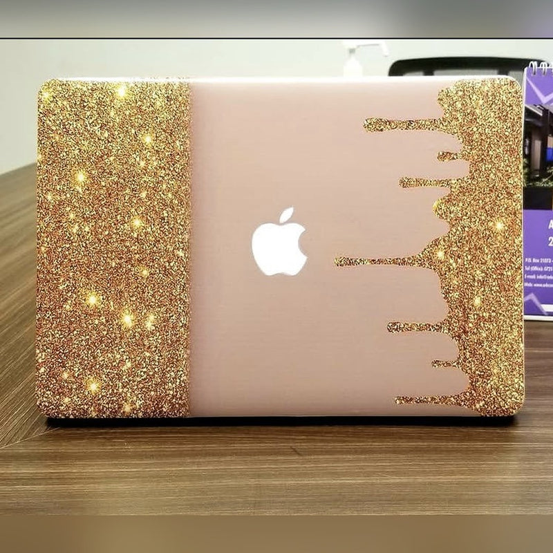 Gold Glitter Drip laptop skin on a MacBook lid