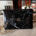 Midnight Marble laptop skin on a MacBook lid