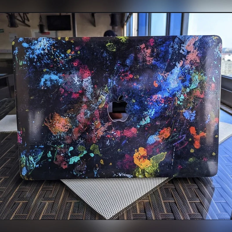 Paint Splatter laptop skin on a MacBook lid