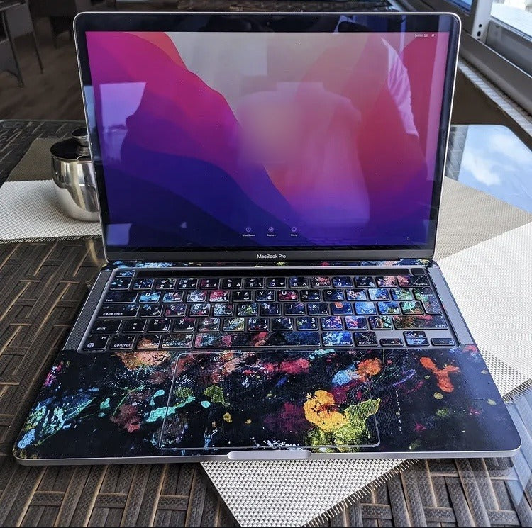 Paint Splatter laptop skin on a MacBook keyboard