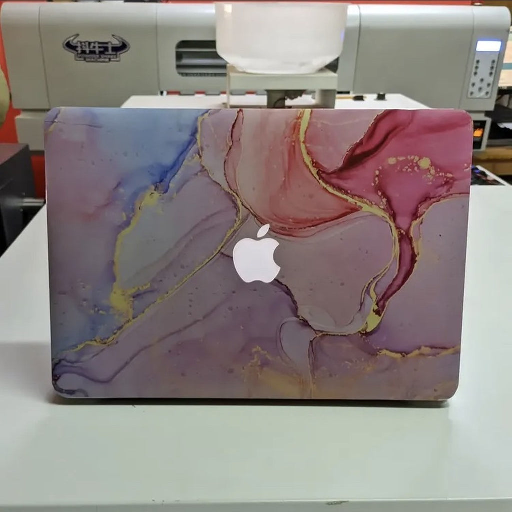 Pastel Gold Vein laptop skin on a MacBook lid