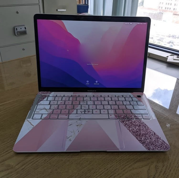 Pink Prism Glitter laptop skin on a MacBook keyboard