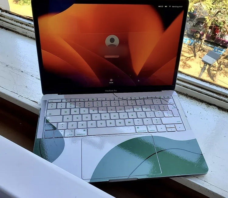 Sage Contour laptop skin on a MacBook keyboard