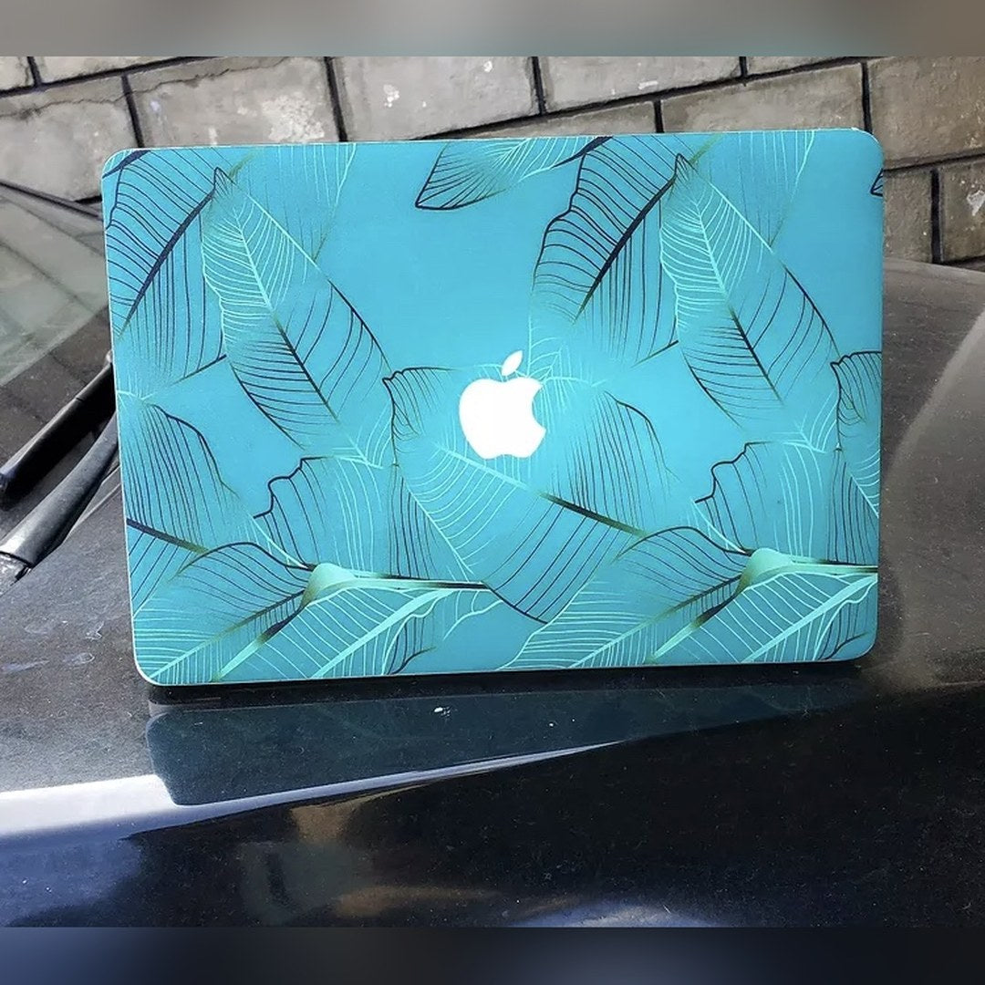 Teal Palm laptop skin on a MacBook lid