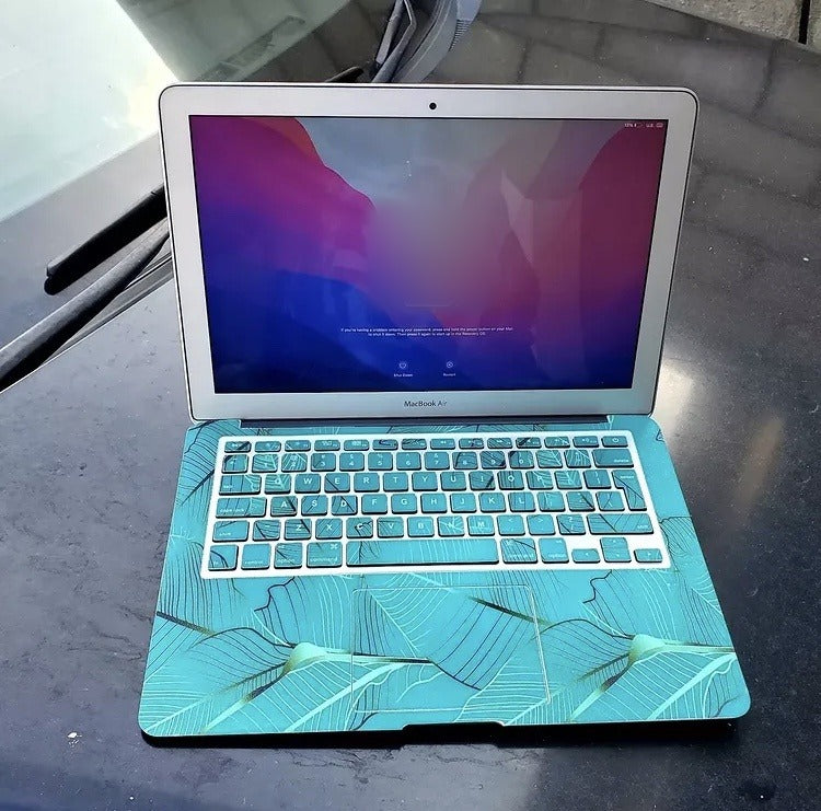 Teal Palm laptop skin on a MacBook keyboard