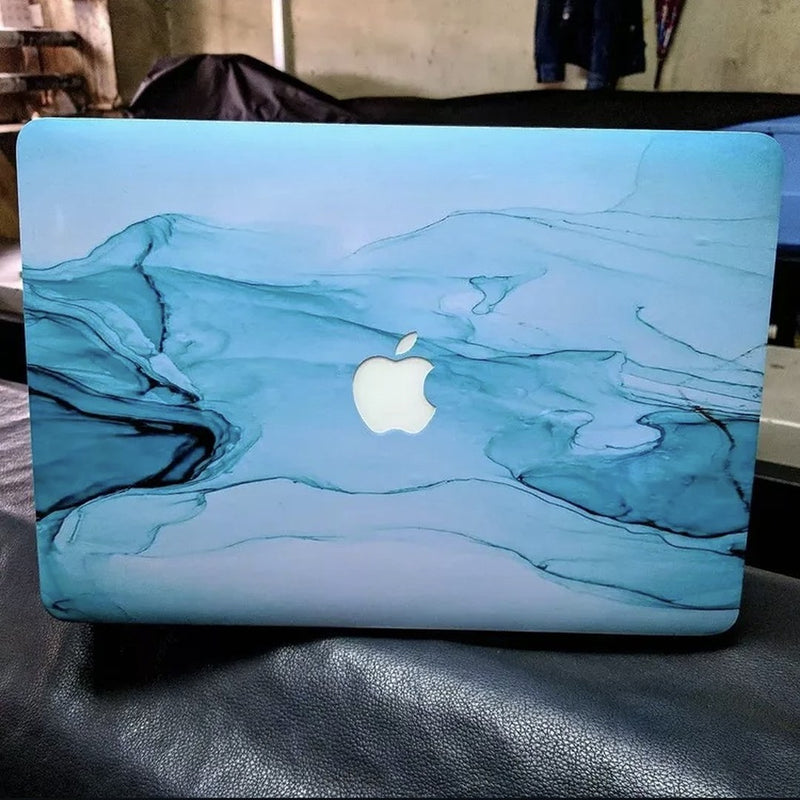 Teal Tide Marble laptop skin on a MacBook lid