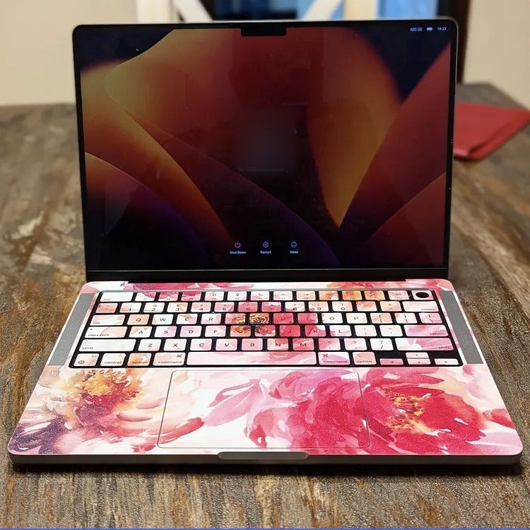 Watercolour Peony laptop skin on a MacBook keyboard