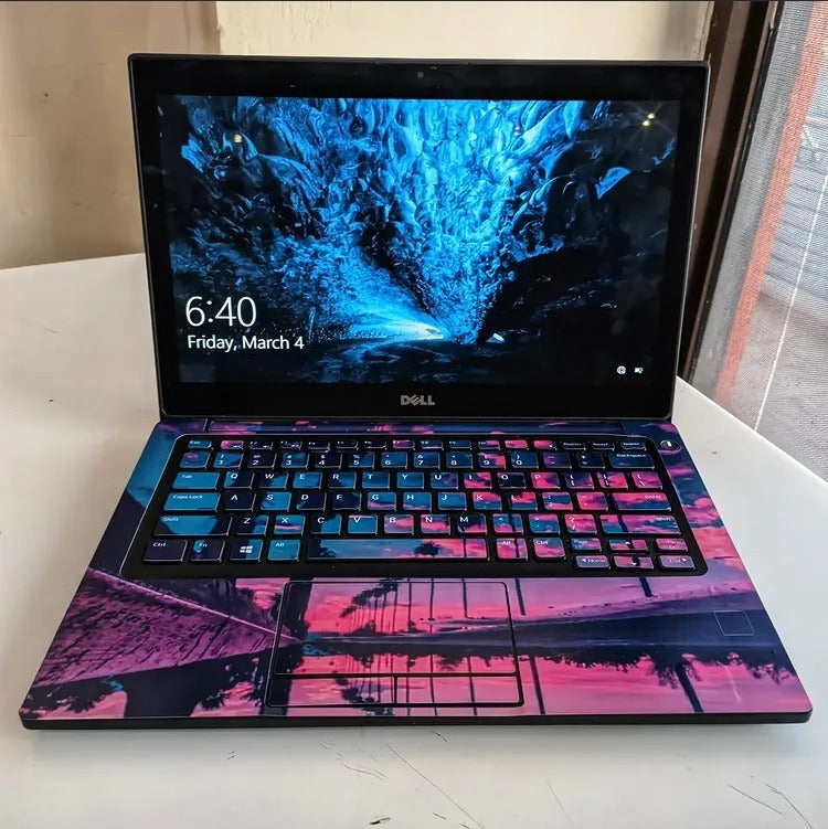 Neon Palm Sunset laptop skin on a Dell keyboard