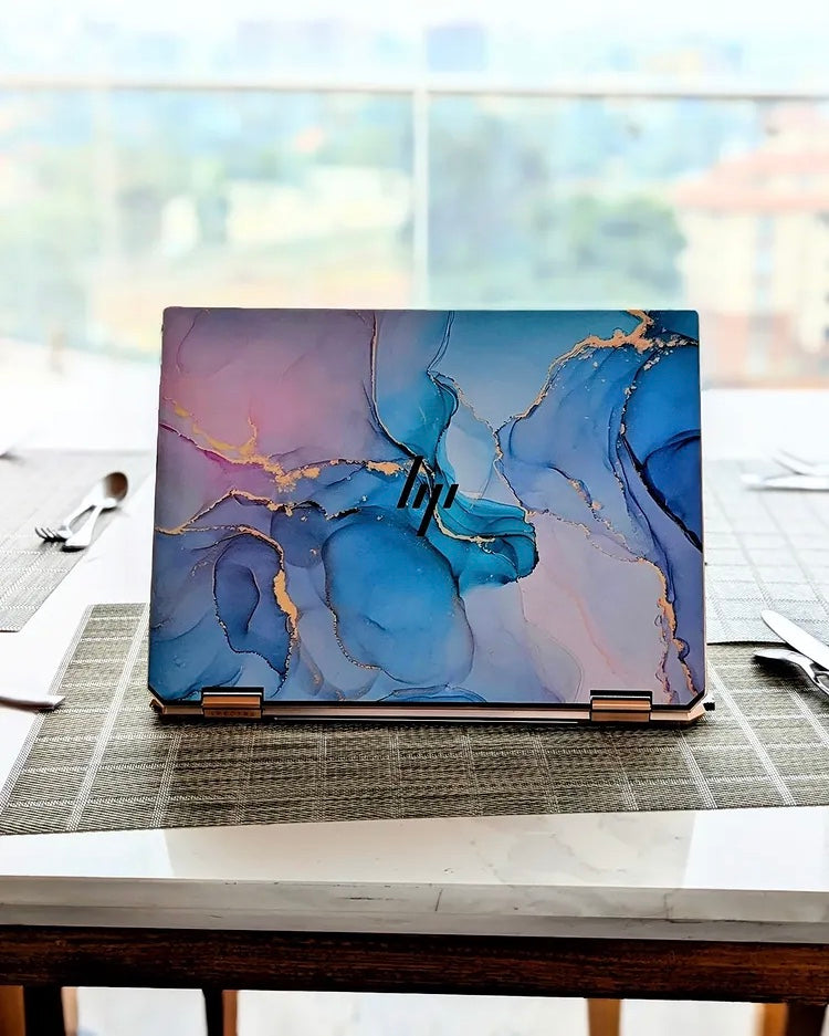 Periwinkle Gold Marble laptop skin on an HP lid
