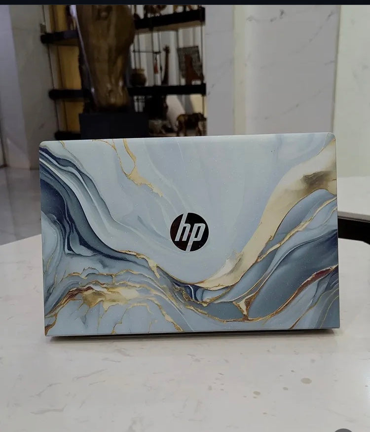 Silver Wave Marble laptop skin on an HP lid