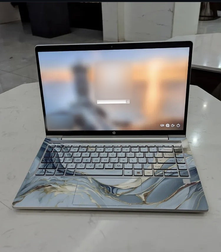 Silver Wave Marble laptop skin on an HP keyboard