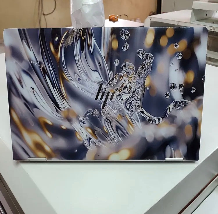 Liquid Chrome laptop skin on an HP lid