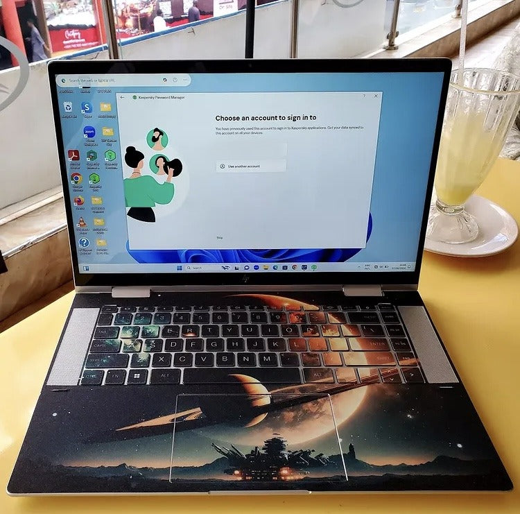 Planet Rise laptop skin on an HP keyboard, keys darkened for visibility