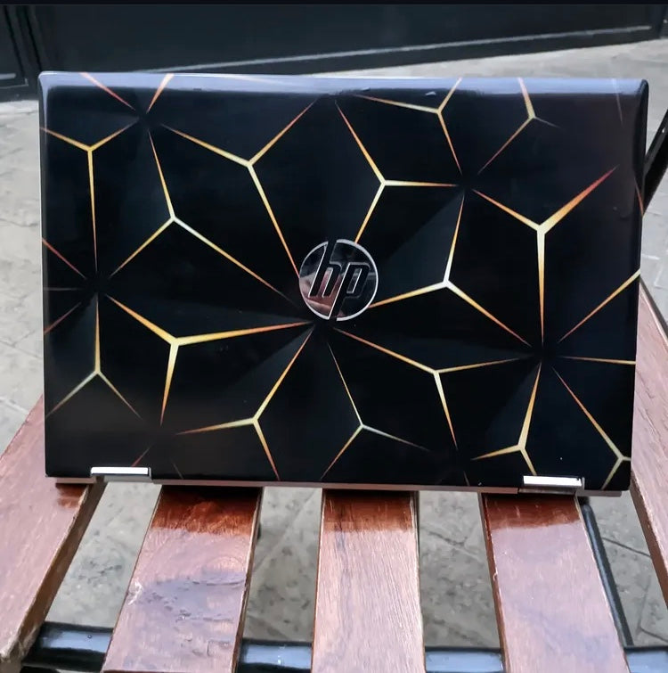 Gold Geometric laptop skin on an HP lid