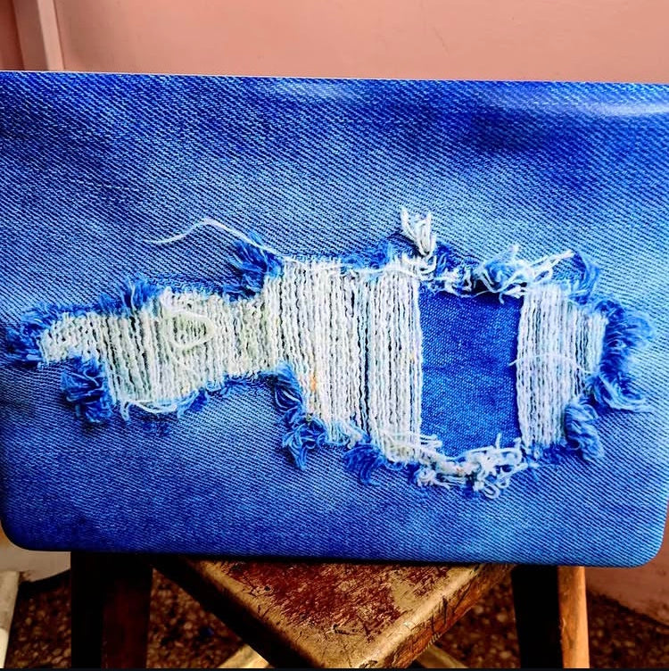 Ripped Denim laptop skin on an HP lid