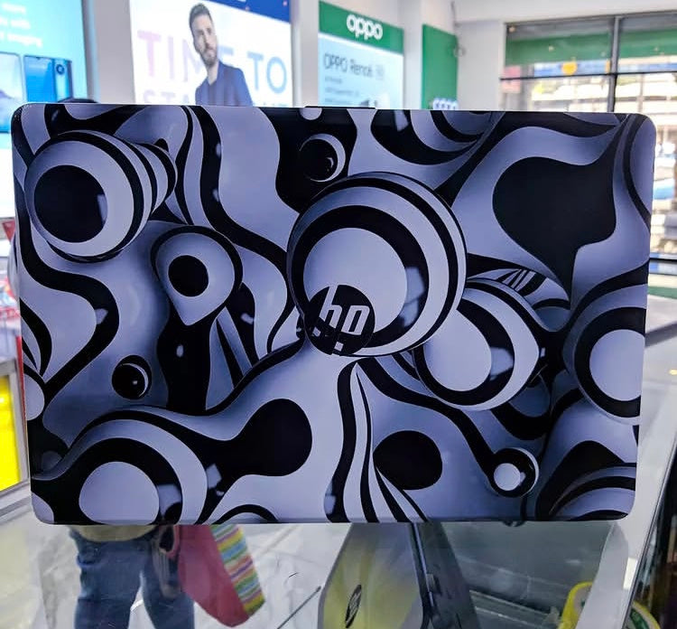 Monochrome Swirl laptop skin on an HP lid
