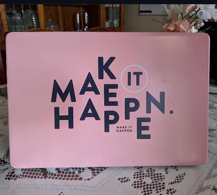 Make It Happen laptop skin on an HP lid