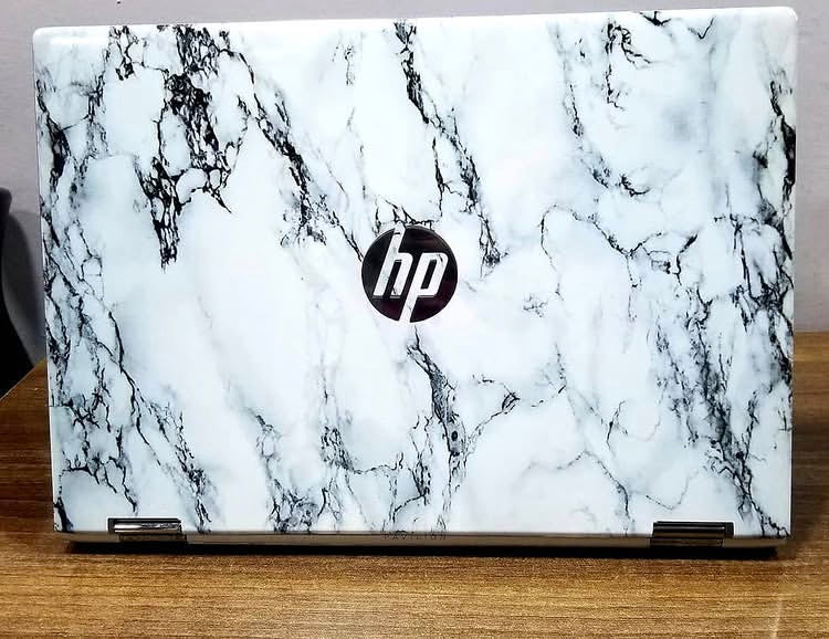 Carrara Classic laptop skin on an HP lid